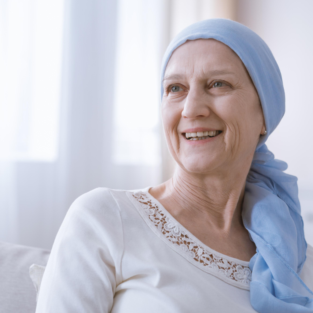 oncology skin care woman with a blue head wrap, smiling