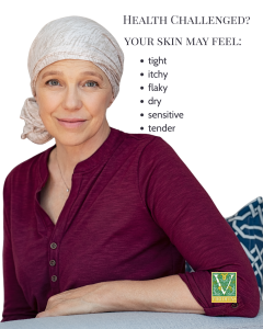 text: Health Challenged? Your skin may feel: tight, itchy, flaky, dry, sensitive, tender. On a photo of a smiling woman wearing a turban and a wine colored blouse