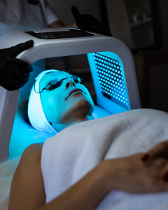 facial treatment with blue LED on a person wearing eye goggles
